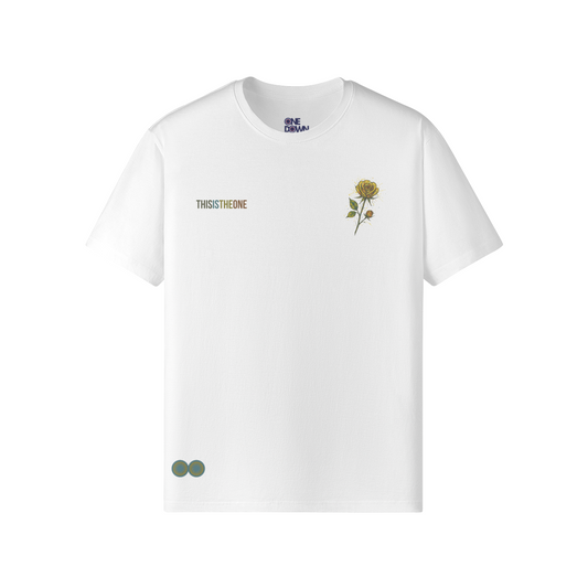White t-shirt with Pollock-style abstract yellow rose on the chest and “THIS IS THE ONE” text. Designed by One Down Clothing.

